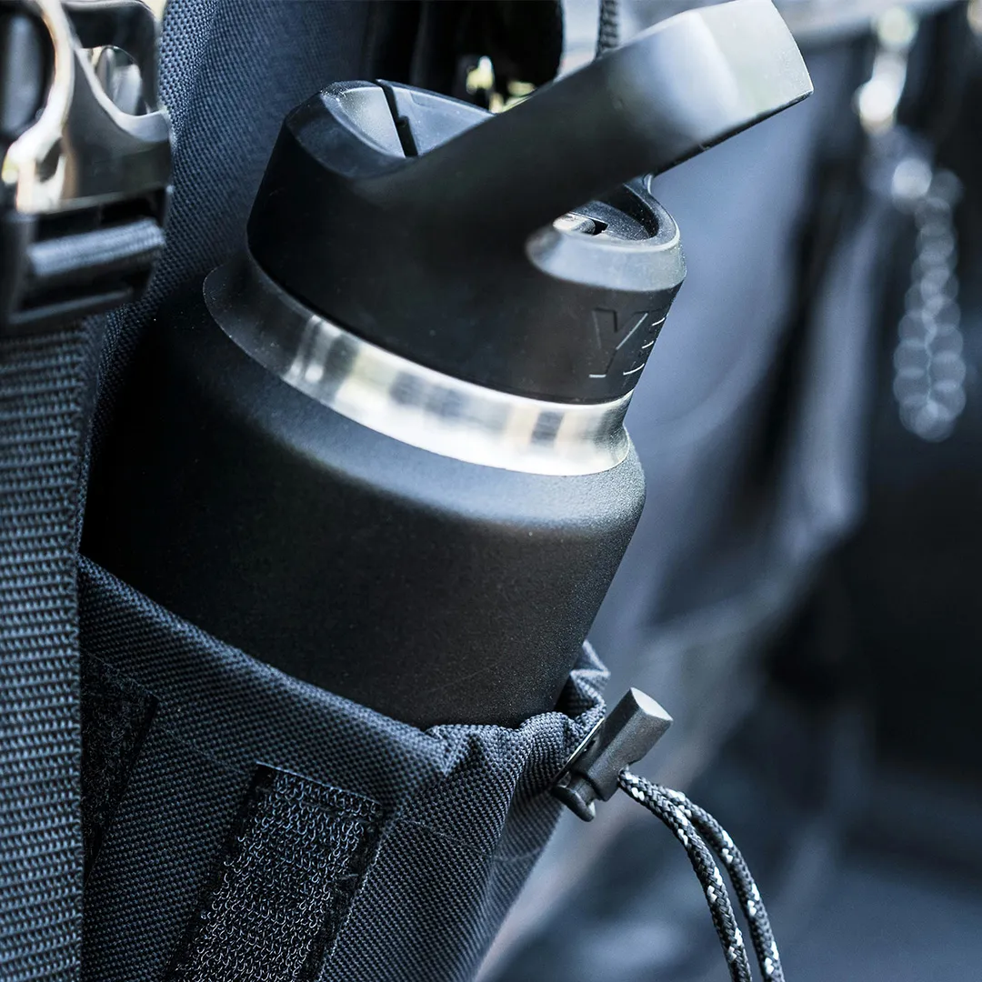 Reusable black water bottle stored in a conference bag, representing practical branded merchandise for events.
